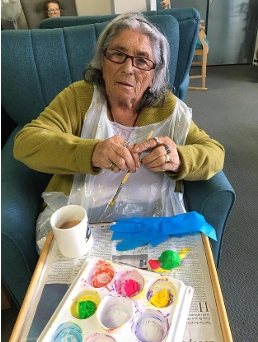 care home resident engaged in crafts